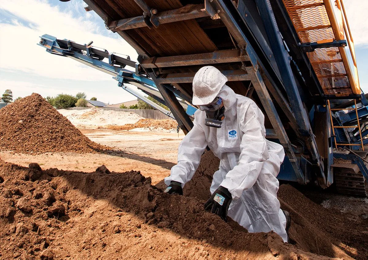 AAH crew manually picking asbestos from screened soil